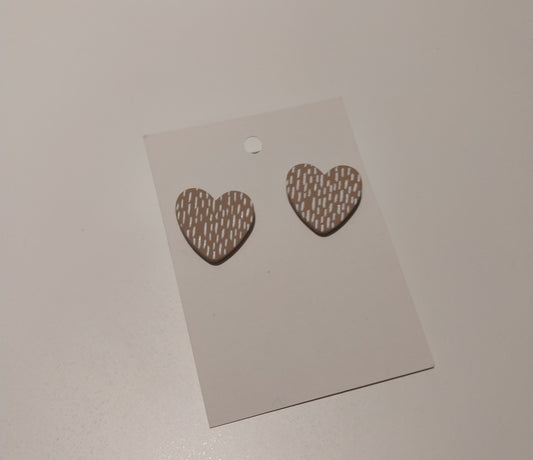 Beige heart studs with white
